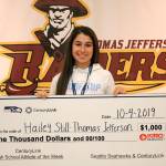Thomas Jefferson senior Hailey Still holds a check for $1,000 to be donated to the TJHS athletics fund, one of the prizes for being honored as the Seattle Seahawks Athlete of the Week for week four. Olivia Sullivan/staff photo