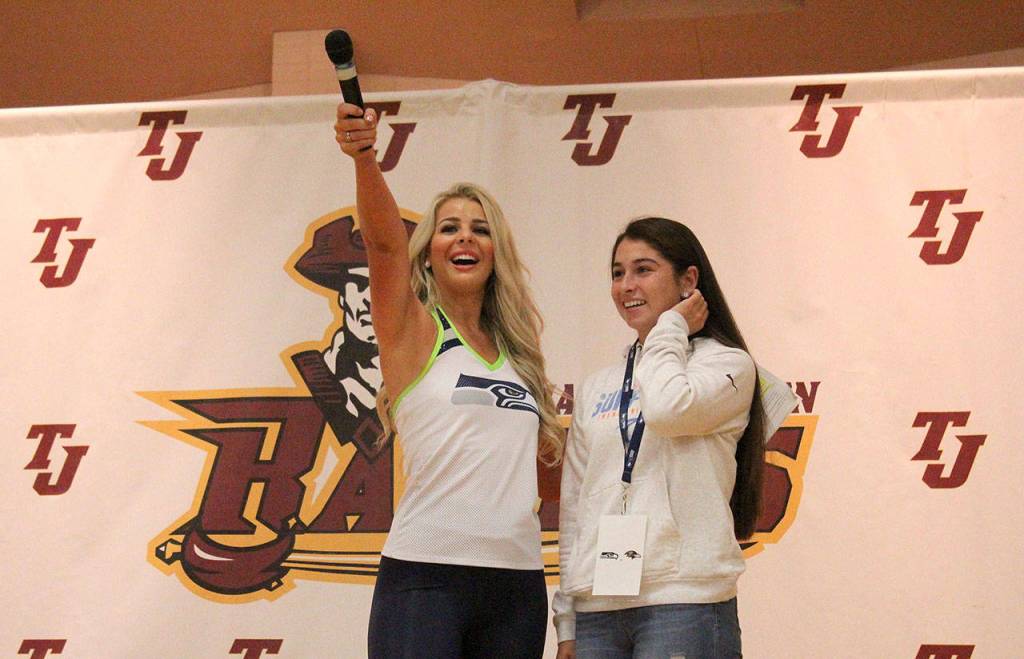 Seahawks Dancer Kylie and TJHS senior Hailey Still lead the school in a Seahawks cheer during the Athlete of the Week celebration on Oct. 4. Olivia Sullivan/staff photo