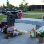 Memorial attendees brought bouquets of flowers to Sarah Yarboroughs memorial bench on Oct. 11. Olivia Sullivan/staff photo