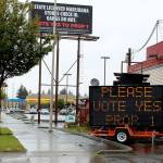 In response to a challenger sign down the road, proponents of Proposition 1 displayed a solar traffic message board reading Please vote yes prop 1 along Pacific Highway South in Federal Way. Olivia Sullivan/staff photo