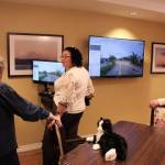 Program Coordinator Angel Johnson explains Clare Bridges InTouch Technology to ribbon cutting attendees. Olivia Sullivan/staff photo