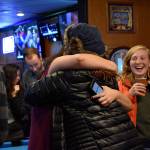 Federal Way Stable Homes organizers cheer and hug after learning Initiative 19-001 is passing in early returns at the election night party at Scoreboard. Haley Donwerth/staff photo