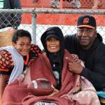 Liny Dannis Frost smiles with her husband, Lavell, and son, Malachi, at the Federal Way Hawks final home game while holding the game ball given to her after her sons touchdown. Liny died earlier this month from cancer. Courtesy photo