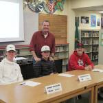 Decatur baseball head coach John Sugg stands with seniors Brady Houston, Mason Hymer, and Spencer Sugg on Monday, Nov. 25. Olivia Sullivan/staff photo