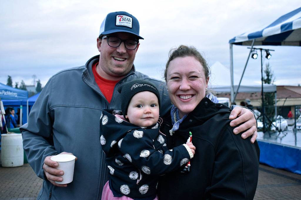 The Naccaratos smile for a photo at the Town Square Park Christmas tree lighting. Haley Donwerth/staff photo