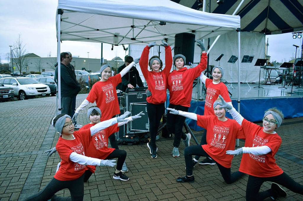 The Childrens Dance Theater poses for a photo before their performance at the Christmas tree lighting event. Haley Donwerth/staff photo