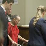 Beverly Lorraine Jenne, 85, uses a walker to assist her to the front of the courtroom during her arraignment on Tuesday morning at the Kent Regional Justice Center. Olivia Sullivan/staff photo