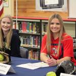 Seniors Maclairen Magruder, left, and Jenna Bettge pose for a photo at the Jan. 17 National Letter of Intent signing. Magruder signed to George Fox University and Bettge signed to play with Skagit Valley College next year. Olivia Sullivan/staff photo