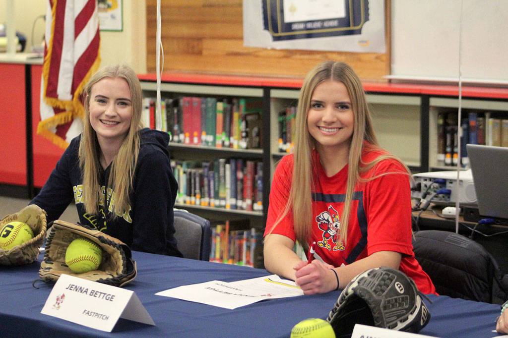Seniors Maclairen Magruder, left, and Jenna Bettge pose for a photo at the Jan. 17 National Letter of Intent signing. Magruder signed to George Fox University and Bettge signed to play with Skagit Valley College next year. Olivia Sullivan/staff photo