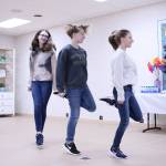 From left: 13-year-old Lois L., 15-year-old Olivia W., and 15-year-old Emily W. perform at the Fire & Ice Irish Dance Company soft opening on Jan. 11. Olivia Sullivan/staff photo