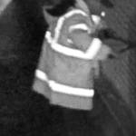 A video still shows the suspect using bolt cutters to cut the lock on one of three storage sheds at Sequoyah Middle School, where he stole athletic equipment. Photo courtesy of King County Sheriffs Office
