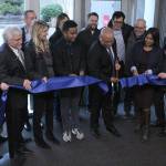Highline College President John Mosby cuts the ribbon to officially open the colleges newly renovated building, with the help of board trustees, local elected officials and project partners. Olivia Sullivan/staff photo