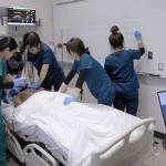 A group of Highline College students practice CPR techniques on a simulation patient on Jan. 31. Olivia Sullivan/staff photo