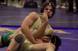 Decaturs Bradley Tyack pins Kentwoods Viet Nguyen in the first round of their 170-pound title bout at the 4A regional meet at Tahoma High School last Saturday. Mark Klaas/Auburn Reporter