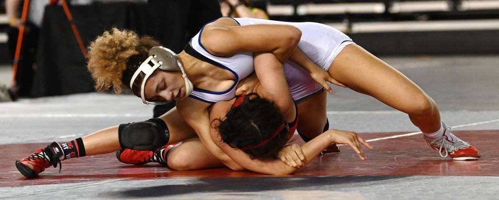 Federal Way junior London Houston rides Grangers Viktorya Torres during their 130-pound title bout. Houston prevailed by major decision 10-2 for her second state crown. RACHEL CIAMPI, Reporter