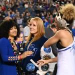 Federal Way junior London Houston celebrates her 130-pound title bout with coach Maria Manzueta, left, and mom Heidi Adams. RACHEL CIAMPI, Reporter