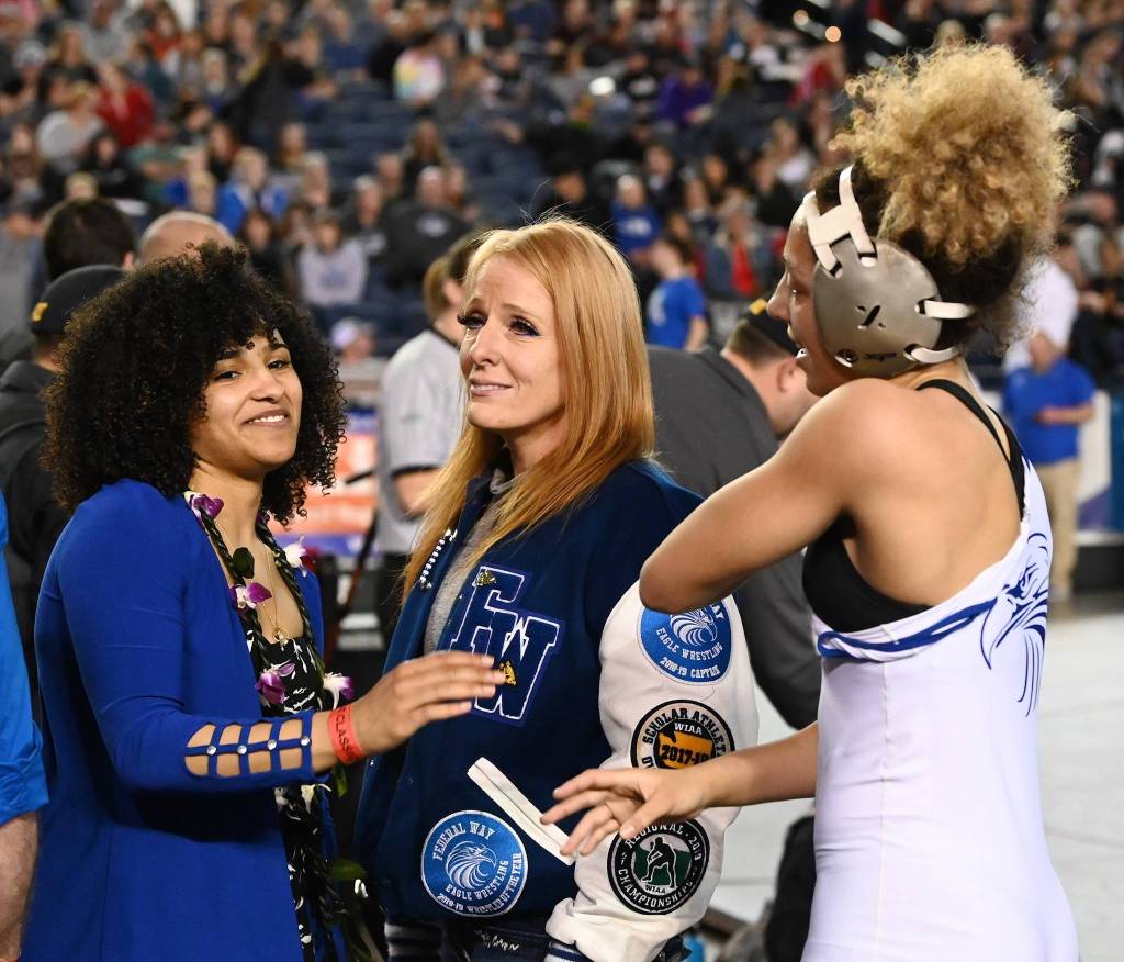 Federal Way junior London Houston celebrates her 130-pound title bout with coach Maria Manzueta, left, and mom Heidi Adams. RACHEL CIAMPI, Reporter