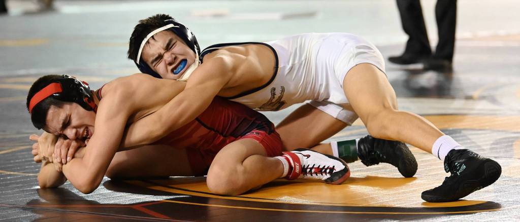 Decaturs 106-pound Collin Jack battles Sunnysides Elijah Barajas for the state title. Barajas won by 1-0 decision. RACHEL CIAMPI, Reporter