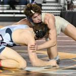 Decaturs Bradley Tyack, top, turns for instruction as he takes on Unions Kyle Brosius for the 170-pound title. Brosius won by decision, 11-7. RACHEL CIAMPI, Reporter