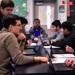 TAF@Saghalie teacher Brandon Carlisle works with his ninth grade biology students on their lab work. Haley Donwerth/staff photo