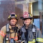 Eric Rickert of Bellevue Fire, right, stands with his younger brother Ed Rickert of South King Fire before the 2018 LLS Firefighter Stairclimb at the Columbia Center. Courtesy photo