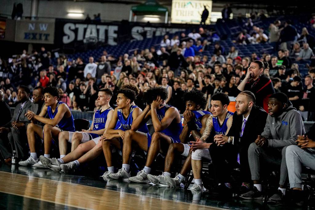 The Federal Way Eagles boys basketball team reacts to the final minutes of Thursdays state quarterfinals game. The Eagles lost 61-49 to Mt. Si. Senad Tiric, for the Mirror