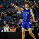 Federal Way senior Peter Erickson makes a pass at the Hardwood Classic state boys basketball tournament Thursday, March 5 at the Tacoma Dome. Senad Tiric, for the Mirror