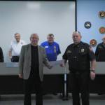 Practicing social distancing, the South King Fire Board commissioners (back row) and Chief Vic Pennington (front right) pose for a photo with the newest board appointee David Berger (front left) on Monday, March 23. Olivia Sullivan/staff photo