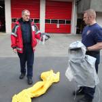 Lt. Greg Willett, left, and firefighter Eric Kiphart show the various types of personal protective equipment used by members of the hazmat team. Olivia Sullivan/staff photo