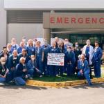 Emergency Department staff smile for a photo outside of St. Francis Hospital with a sign thanking community members for their support during the COVID-19 pandemic. Courtesy photo
