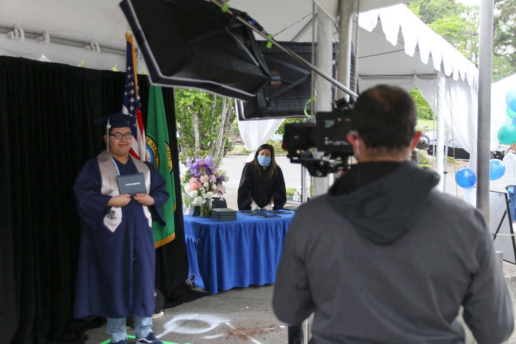 A Todd Beamer High School senior smiles during the graduation walk recording on May 20. Olivia Sullivan/staff photo