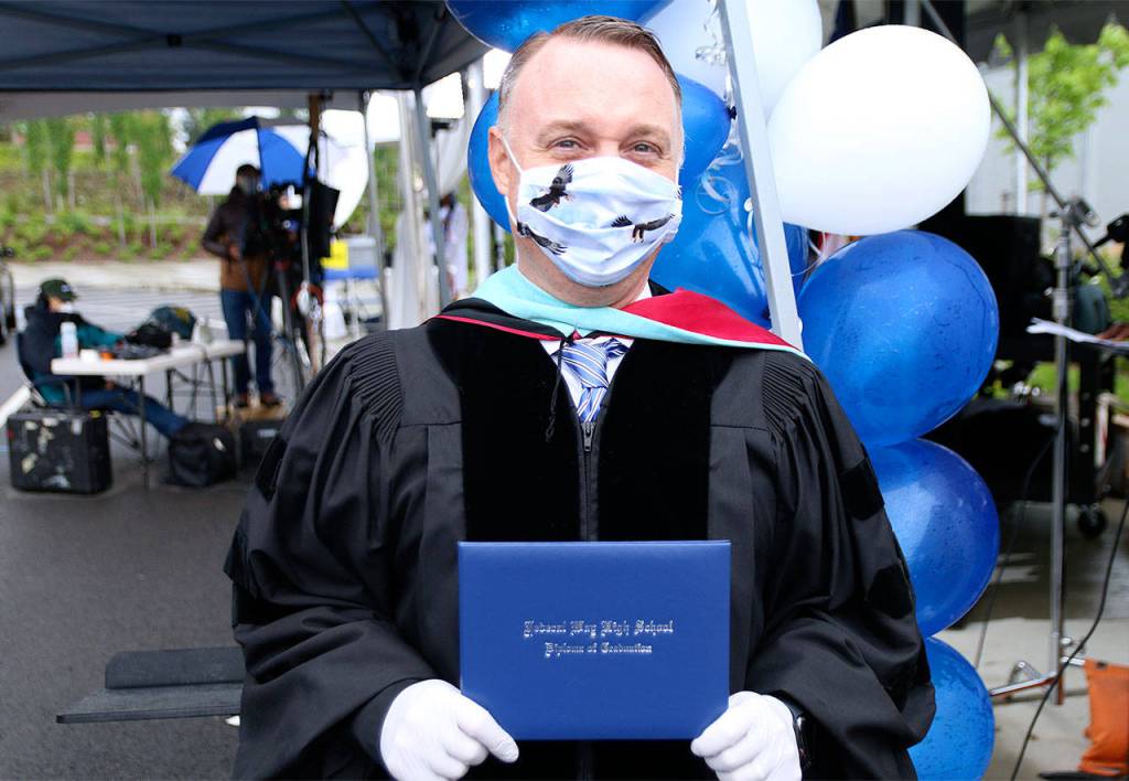 Federal Way High School principal Dr. Matt Oberst wears a face mask made by his daughter featuring eagles fabric. Olivia Sullivan/staff photo