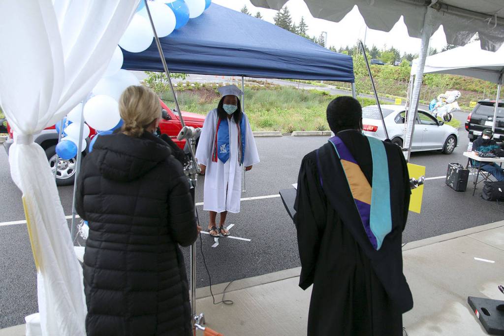 A Federal Way High School senior listens to protocols for the graduation walk recording on May 20. Olivia Sullivan/staff photo
