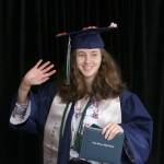 A Todd Beamer High School senior waves to her family, waiting in their car off camera, during the May 20 graduation walk recording. Olivia Sullivan/staff photo