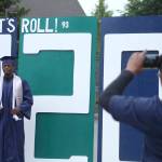 Brycen Dillworth poses in front of a Todd Beamer High School decoration while his family takes photos on May 20. Olivia Sullivan/staff photo