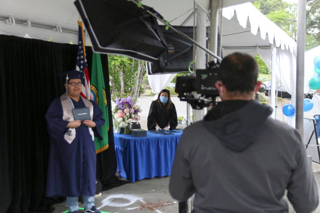 A Todd Beamer High School senior smiles during the graduation walk recording on May 20. Olivia Sullivan/staff photo