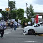 A man in his car stopped at the intersection raises his fist in solidarity with a protester crossing the street on Sunday, May 31. Olivia Sullivan/staff photo