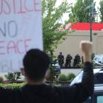 Federal Way officers in riot gear standby at Sundays peaceful protest in Federal Way. Olivia Sullivan/staff photo