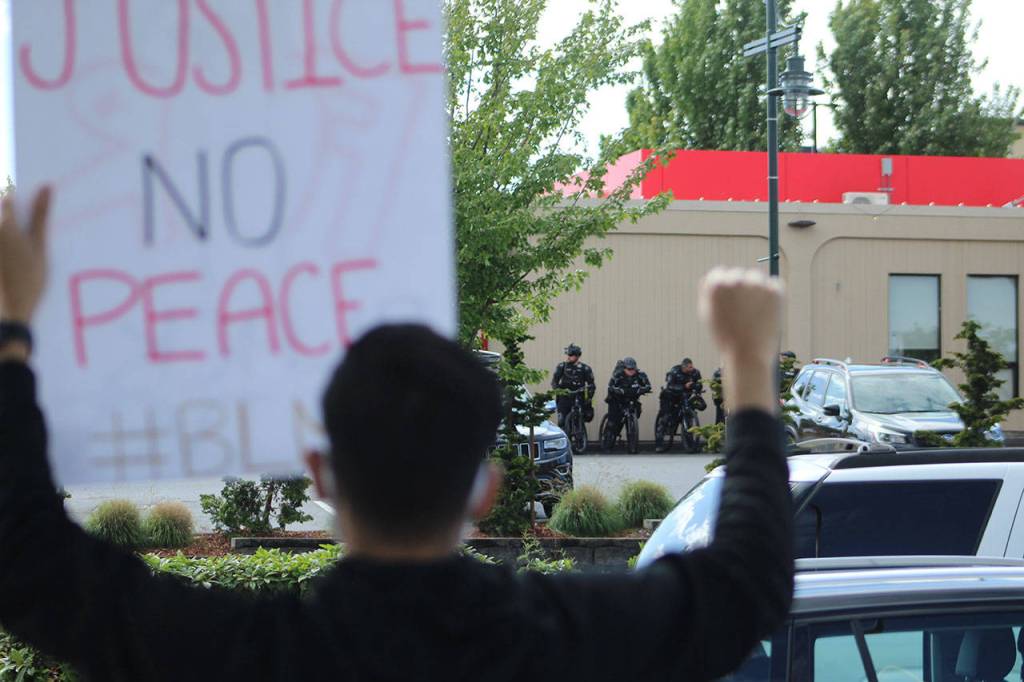 Federal Way officers in riot gear standby at Sundays peaceful protest in Federal Way. Olivia Sullivan/staff photo