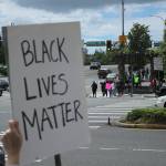 A protester holds a Black Lives Matter sign on Sunday, May 31, in Federal Way. Olivia Sullivan/staff photo