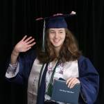 A Todd Beamer graduate waves to her family after receiving her diploma at Federal Way Public Schools graduation walk recordings on Wednesday, May 20. Olivia Sullivan/staff photo