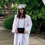 A graduate from Truman Campus Internet Academy holds her diploma at the graduate walk recordings. Courtesy photo