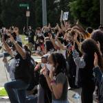 Nearly 75 students and community members kneel outside of Thomas Jefferson High School, chanting hands up, dont shoot to protest the killing of George Floyd and support the Black Lives Matter movement on June 10. Olivia Sullivan/staff photo