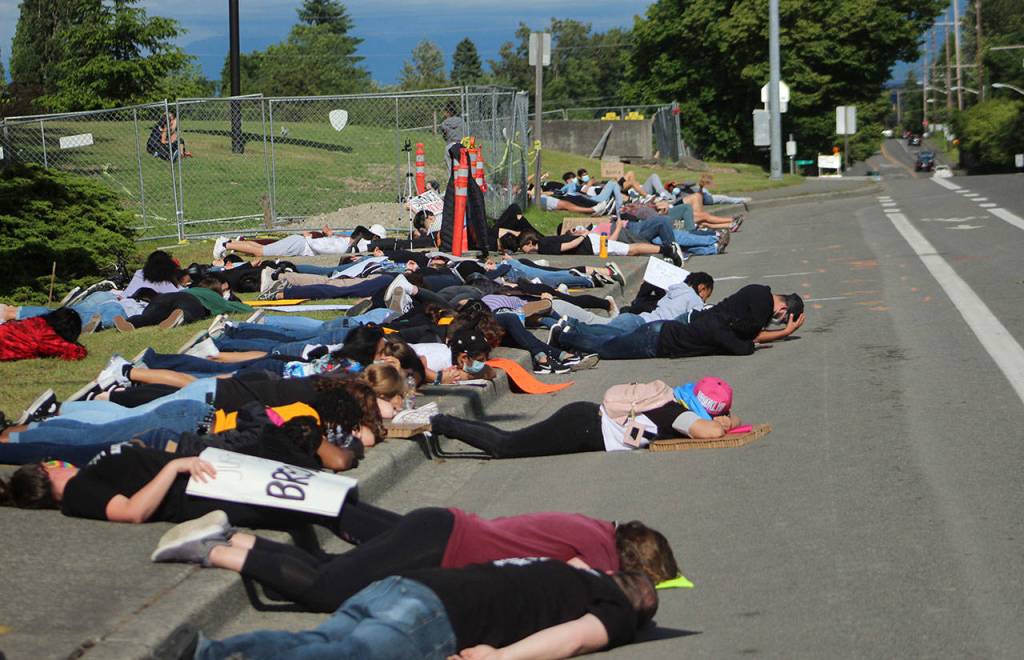 Protesters laid for eight minutes to honor the life of George Floyd. Alfonso Saucedo, center with his head in his hands, said afterwards: You cannot believe how long eight minutes is. Olivia Sullivan/staff photo