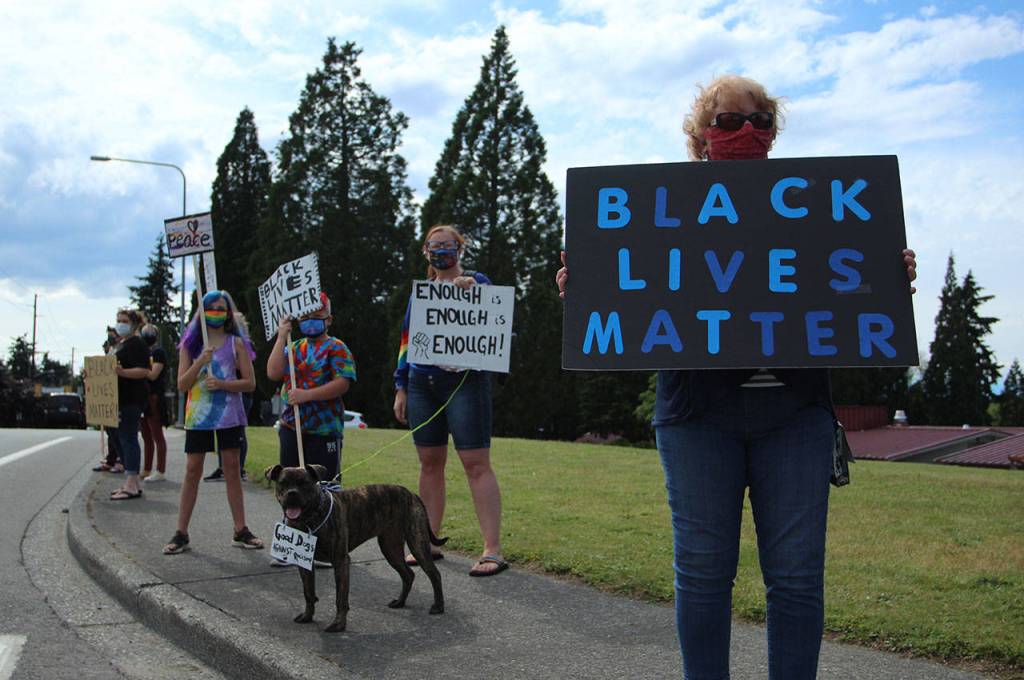 Protesters and a pup named Mandi stood in solidarity on Wednesday, June 10. Olivia Sullivan/staff photo