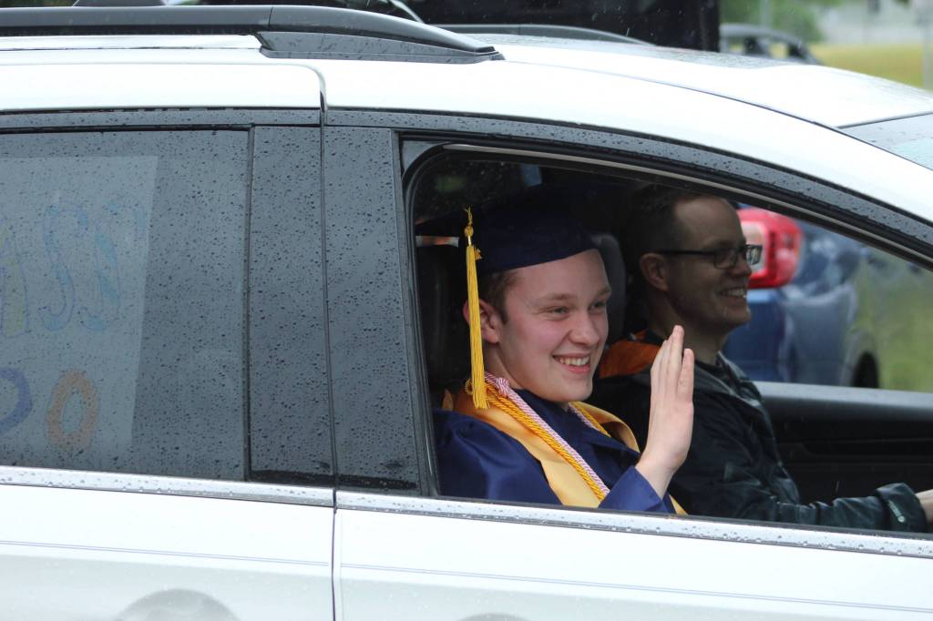 A Decatur senior waves to soon-to-be former teachers on Friday, June 12.