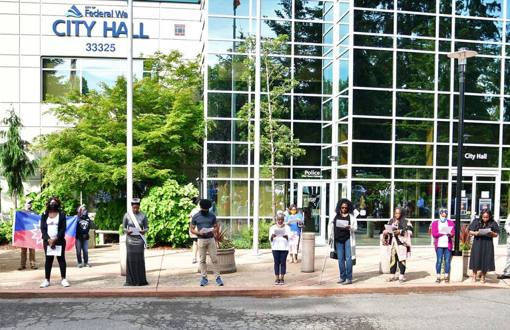 Local leaders read the citys proclamation declaring June 15-21, 2020 as Juneteenth Week. Photo by Bruce Honda