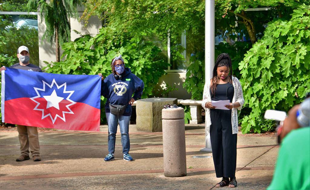 13-year-old Anisah Rogers reads Maya Angelous poem Still I Rise on June 19. Photo by Bruce Honda