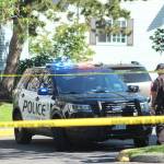 Federal Way police officers investigate a crime scene on July 26. Olivia Sullivan/staff photo
