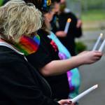 Sen. Claire Wilson holds a candle during the June 26 ceremony. Photo courtesy of Bruce Honda